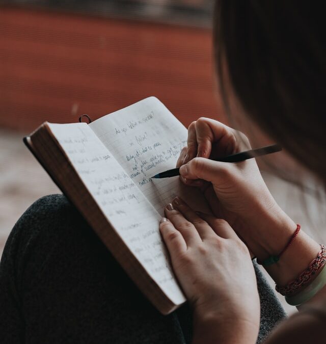 Women writing in journal